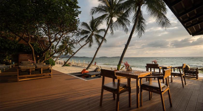 a beach area with chairs, tables and umbrellas, Samui Paradise Chaweng Hotel (SHA Plus+) in Koh Samui