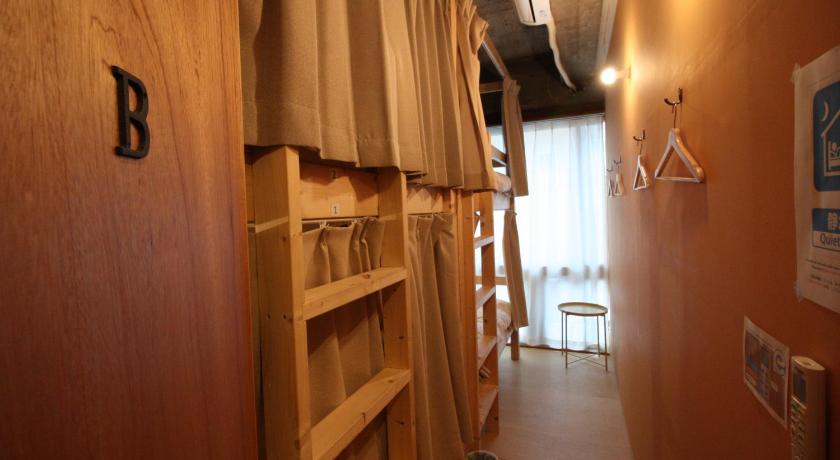 a room with a wooden floor and wooden walls, Tomarotto, apartment type for 1 group in Takayama