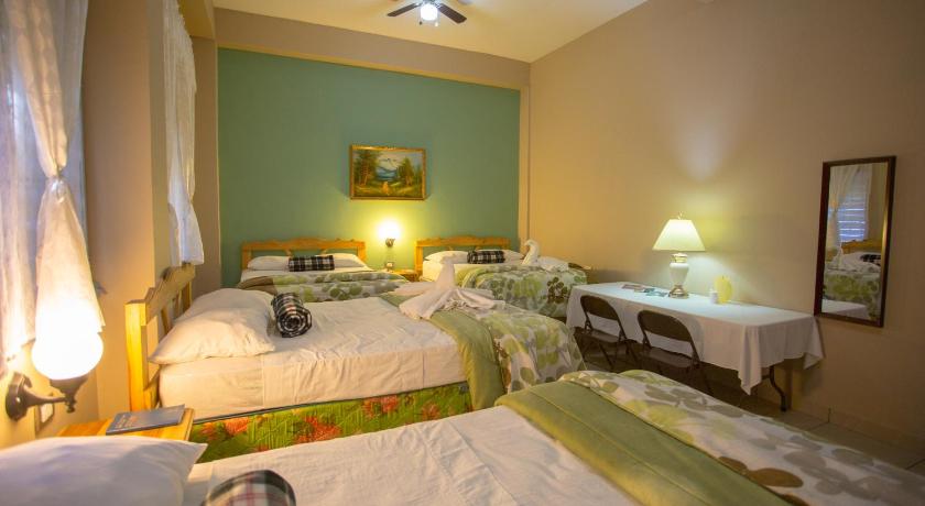 a hotel room with two beds and two lamps, Hotel San Jorge in Santa Rosa De Copan