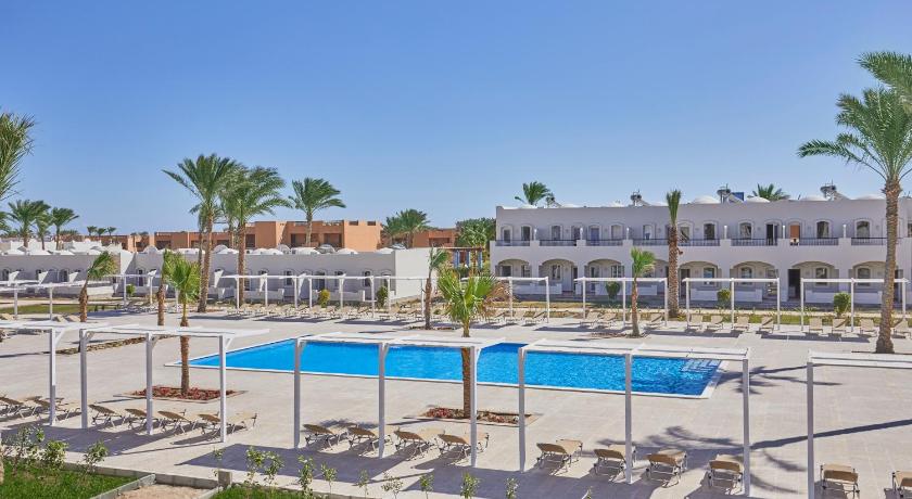 a beach with a pool, tennis courts, and a swimming pool, Solymar Reef Marsa - All Inclusive in Qesm Marsa Alam