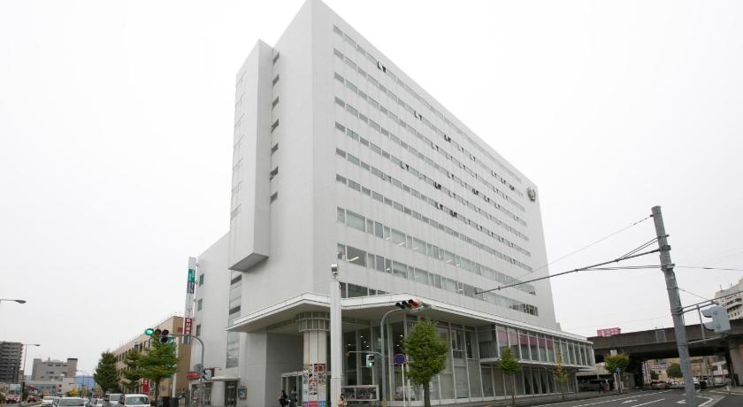 a large building with a clock on the side of it, Tottori Washington Hotel Plaza in Tottori