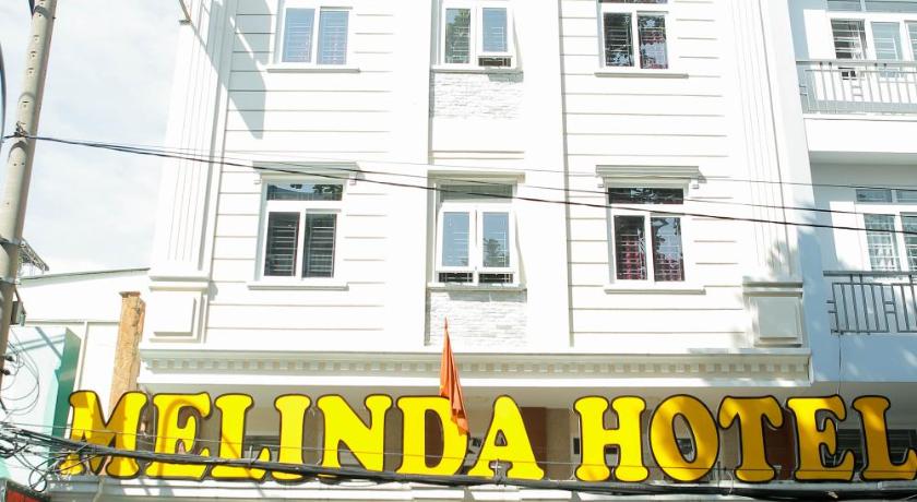 a building with a sign on the front of it, MELINDA HOTEL in Ho Chi Minh City