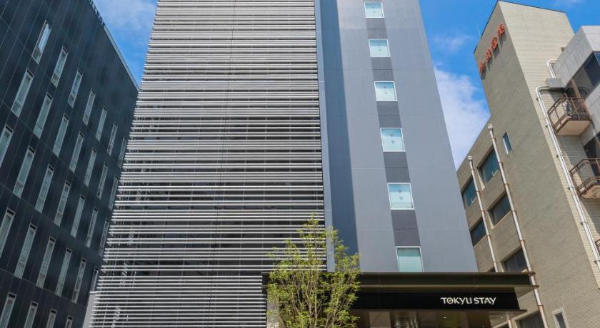 a tall building with a clock on the top of it, Tokyu Stay Hakata in Fukuoka