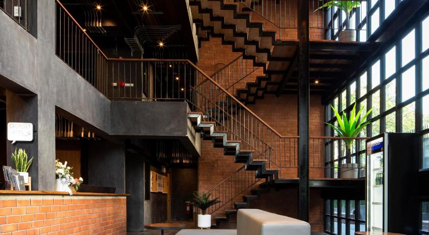 a large stairway with a large clock on it, BED STATION Hostel Khaosan in Bangkok