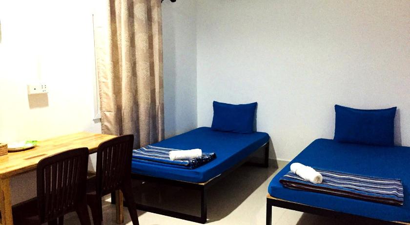 Image of Triple Room with Shared Bathroom 0