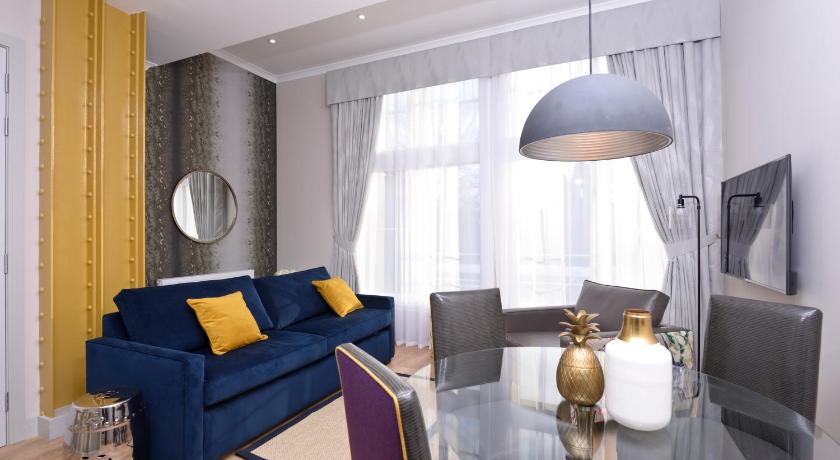 a living room filled with furniture and a window, Destiny Scotland Charlotte Square Apartments in Edinburgh