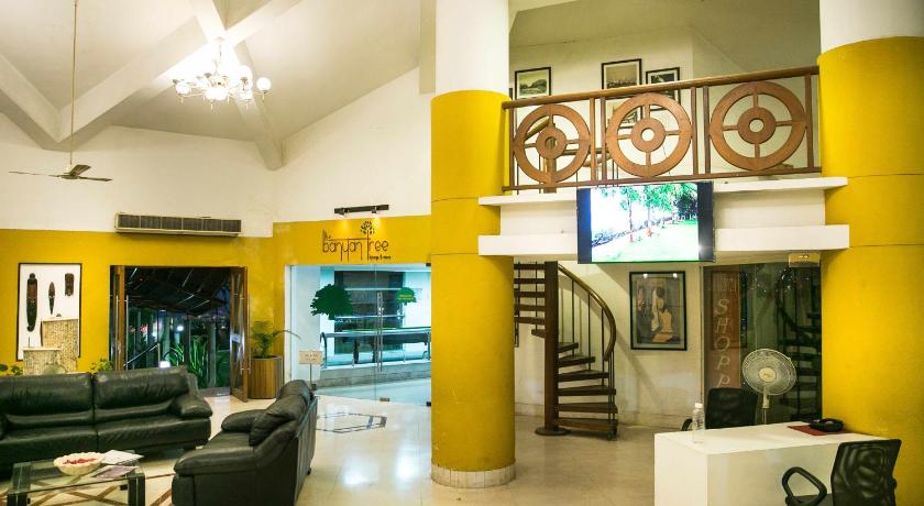 a living room filled with furniture and a large window, Ras Resorts in Silvassa