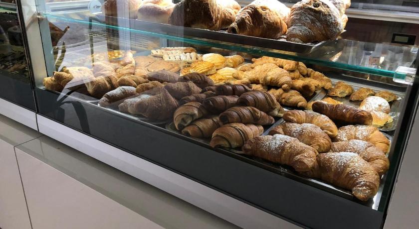 a display case filled with lots of donuts, B&b il castello in Giovinazzo