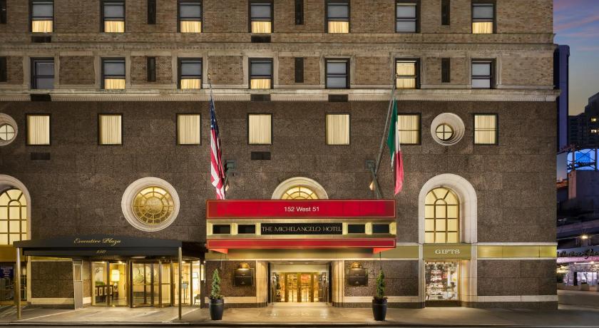 a large building with a clock on the front of it, The Michelangelo New York Hotel in New York (NY)