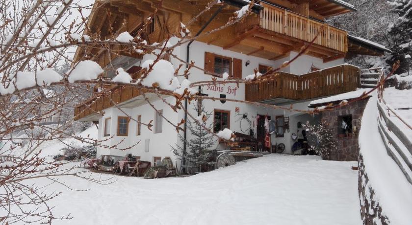 a house with a snow covered roof and a snow covered cabin, Agriturismo Kabishof in Funes