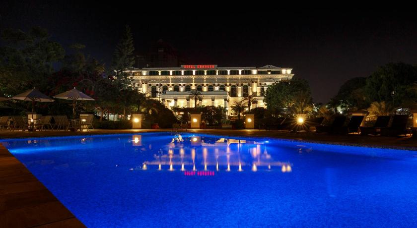 a large swimming pool with a large clock in the middle of it, Hotel Shanker in Kathmandu