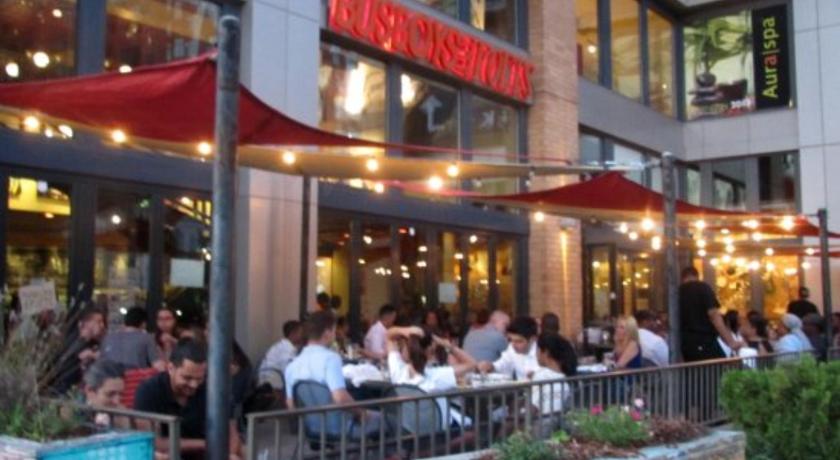 people sitting at tables outside of a restaurant, Steps to Convention Center, Downtown DC, and Metro Station: Private and Comfortable Bedroom/Bathroom in Washington D.C.