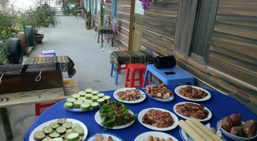 a table topped with plates of food, Sapa Tatu Homestay in Sapa
