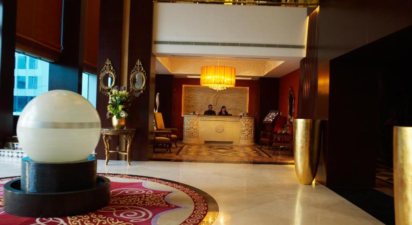 a living room with a fire hydrant on the floor, Ista Suites Seef in Manama