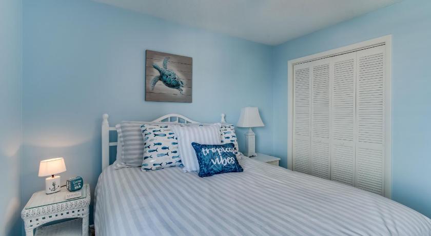a bedroom with a bed and a lamp, Edgewater West #62 in Gulf Shores (AL)