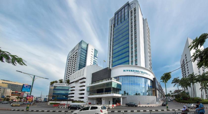 a large building with a clock on the side of it, Astana Wing - Riverside Majestic Hotel in Kuching