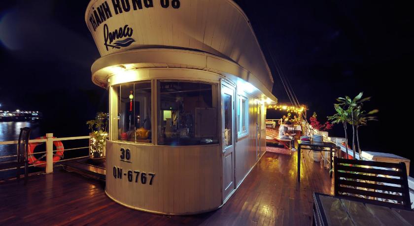 a restaurant with a neon sign on the side of the building, Renea Cruises Halong in Hạ Long