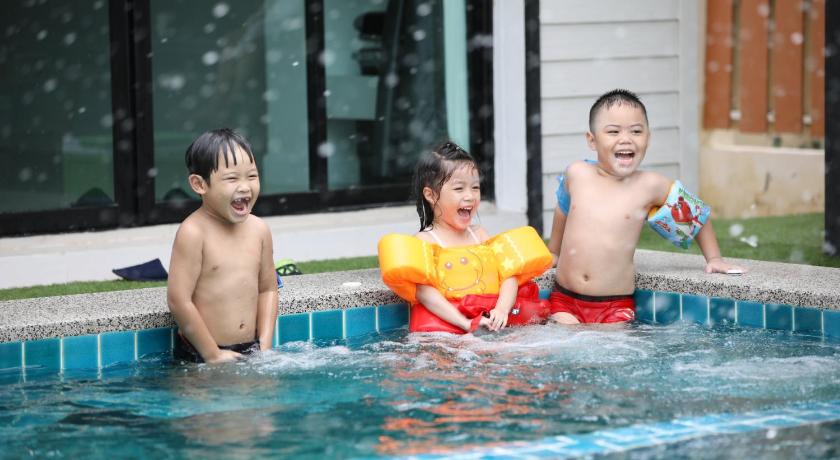two boys and a girl playing in a pool of water, Sierra Villa 102 in Hua Hin / Cha-am