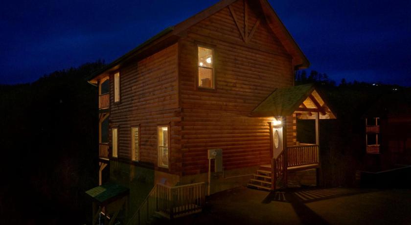 a house that has a fire place in it, Otter Springs Pool Cabin in Pigeon Forge (TN)