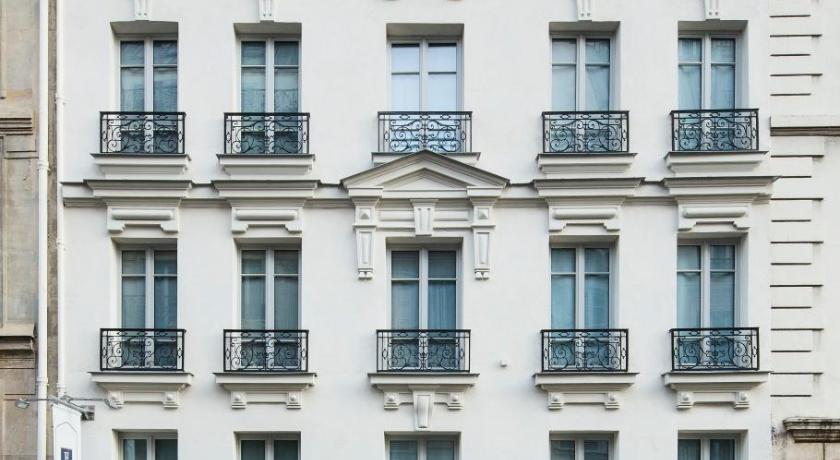a large white building with a window on the side of the building, Best Western Premier Faubourg 88 in Paris