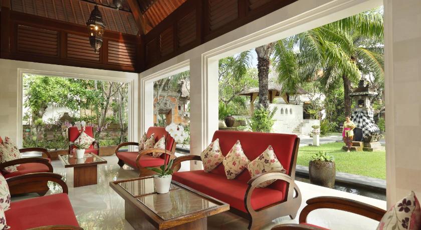 a living room filled with furniture and a large window, Griya Santrian a Beach Resort in Bali