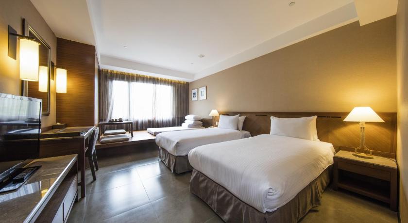Imagine din Cameră deluxe twin în zona hotel, cu pat suplimentar tip futon (Hotel Zone - Deluxe Twin Room with Extra Futon Bed) 0