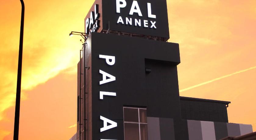 a large building with a clock on the front of it, Pal Annex Oita (Love Hotel) in Oita