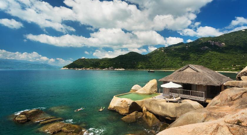 a rocky shoreline with a view of the ocean, Six Senses Ninh Van Bay in Nha Trang
