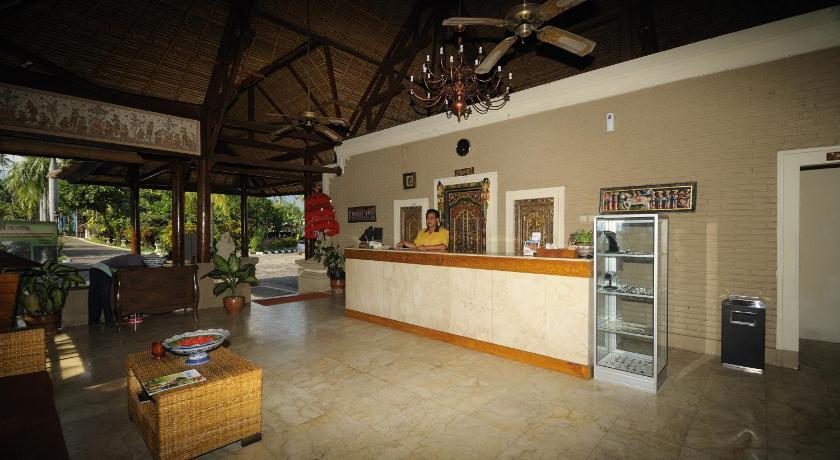 a kitchen with a refrigerator and a table in it, Aneka Lovina Villas & Spa in Bali