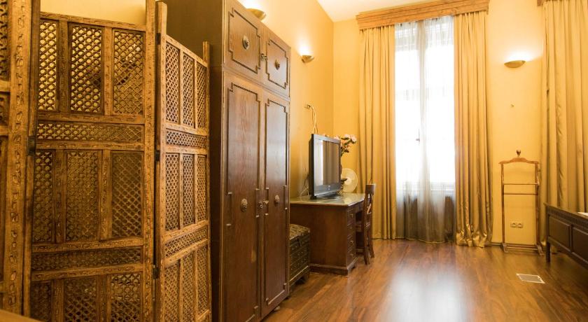 a room with a wooden floor and wooden walls, Budapest Royal Suites in Budapest