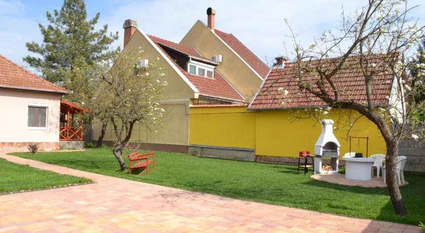 a house with a tree in front of it, Liliom Apartman in Gyula