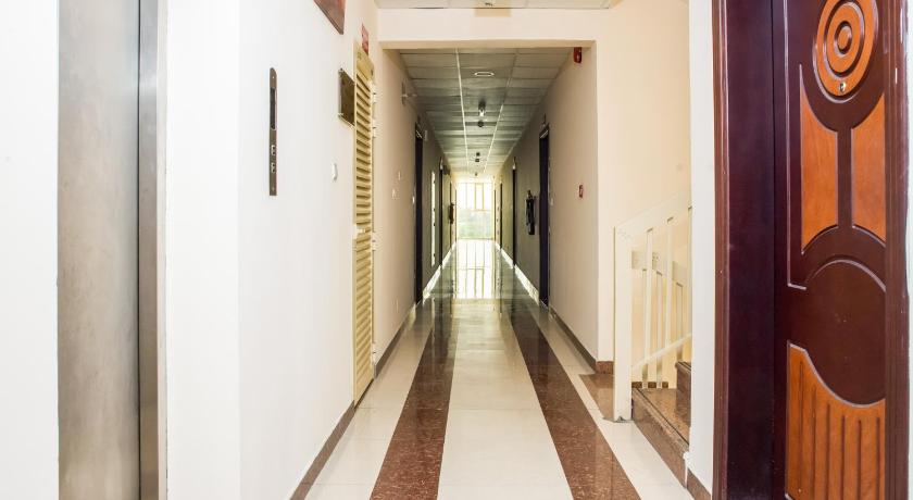 a hallway with a door leading to a hallway with a door leading to a, Al Nakheel Hotel Apartments in Ras Al Khaimah