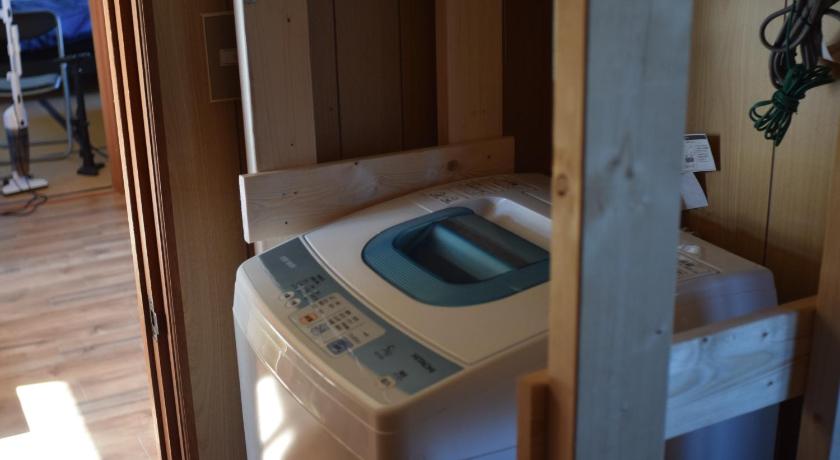 a bathroom with a toilet and a sink, Shoei backpackes hostel in Kushiro