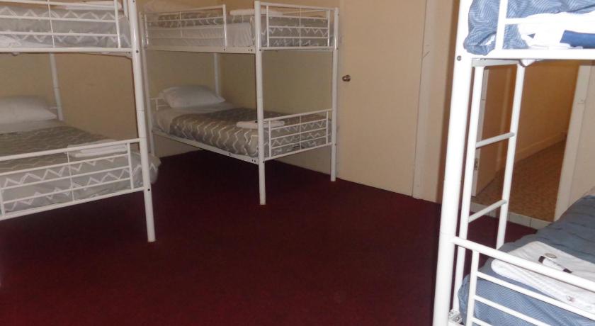 two bunk beds in a small room, Adelaide Backpackers and Travellers Inn in Adelaide