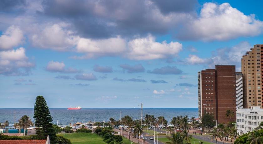 a large building with a view of the ocean, Onomo Hotel Durban in Durban