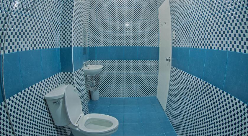 a bathroom with a toilet and a shower stall, The Half House by Elmar Cabin in Baguio