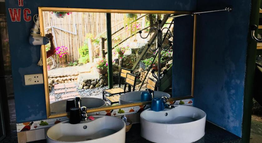 a bathroom with a sink and a mirror, Green Hill Hostel & Tour in Ha Giang