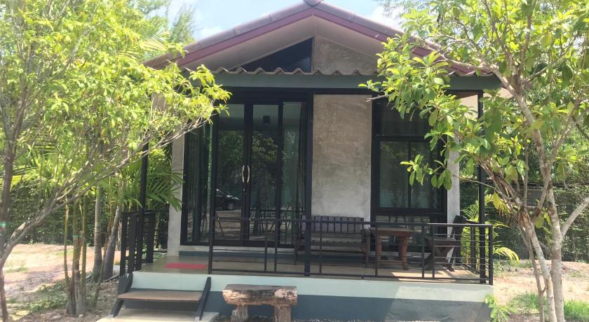 a large white building with a large window, Sangkaset Resort in Prachinburi