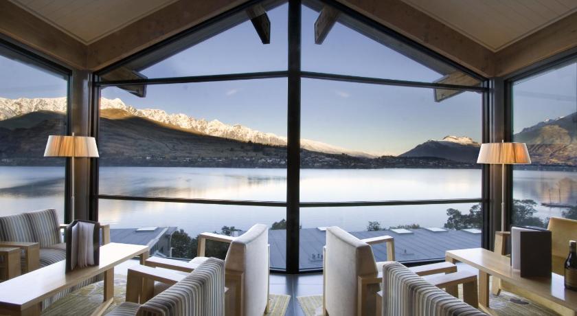 a hotel room with a view of the ocean, The Rees Hotel & Luxury Apartments in Queenstown