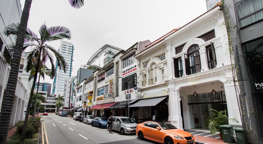 a city street filled with cars and buildings, Heritage Collection on Seah- A Digital Hotel in Singapore
