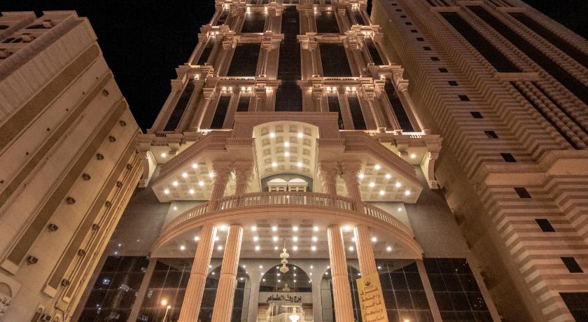 a large building with a clock on the front of it, Rahaf Al Mashaer Hotel in Mecca