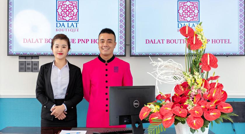 a man and a woman standing next to each other, Dalat Boutique Hotel in Dalat