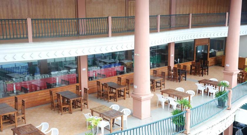 a large building with many tables and chairs in it, Bel Aire Patong, Phuket By The ASHLEE in Phuket
