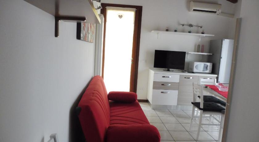 a living room with a couch and a coffee table, Villaggio Laguna app.to 5 e 38 in Caorle