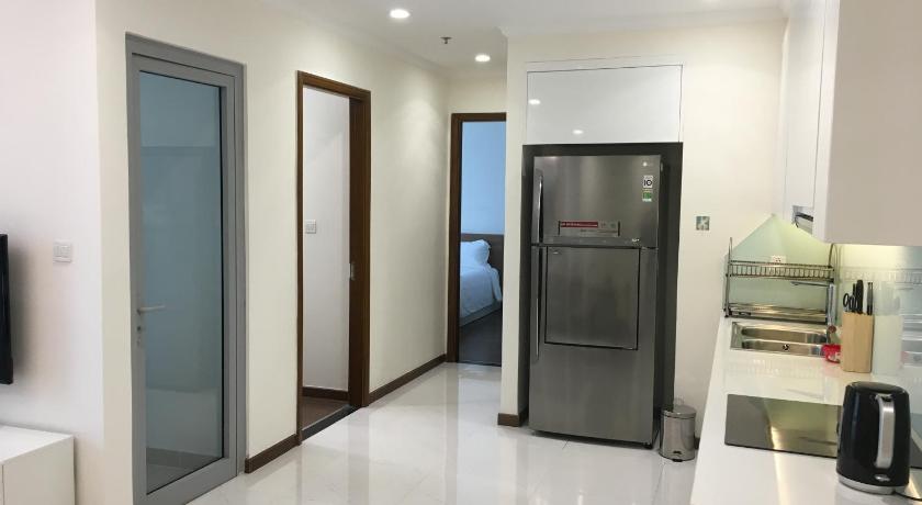 a kitchen with a refrigerator, stove and a sink, Capitalland's Service Apartment Landmark 6 Vinhomes in Ho Chi Minh City