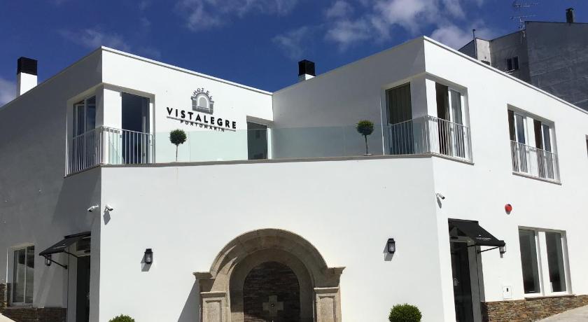 a white building with a large white building behind it, VISTALEGRE Hotel-Spa in Portomarin