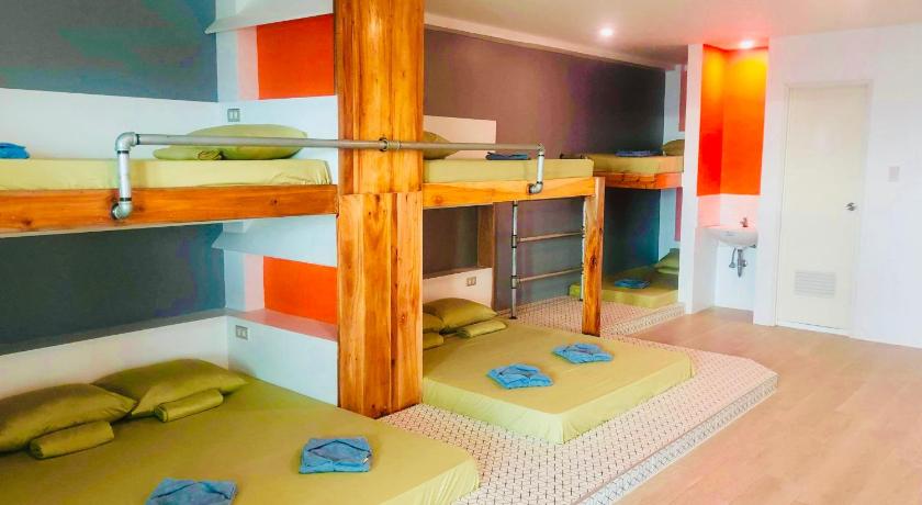 a room with two bunk beds and a desk, The Escape San Juan in La Union