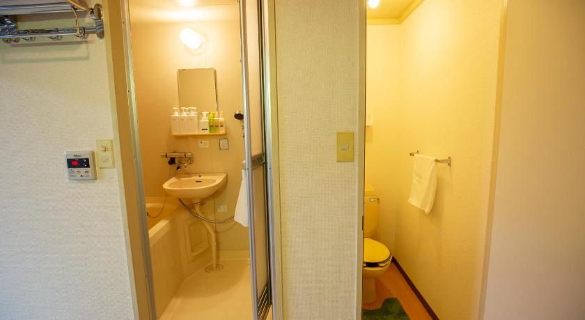 a bathroom with a toilet and a sink, Guest House Life Field in Kurashiki
