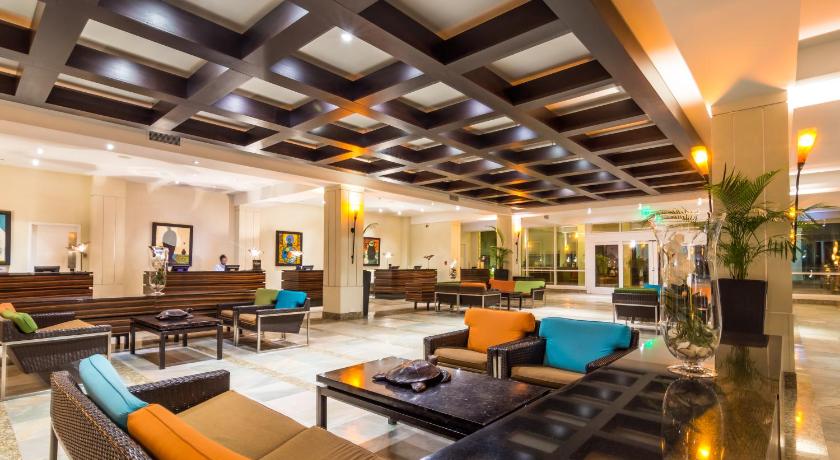 a living room filled with lots of furniture, Hilton Rose Hall Resort & Spa in Montego Bay