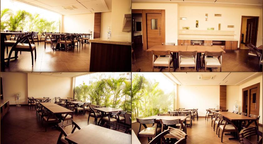 a dining room table and chairs in a room, The Pioneer in Visakhapatnam